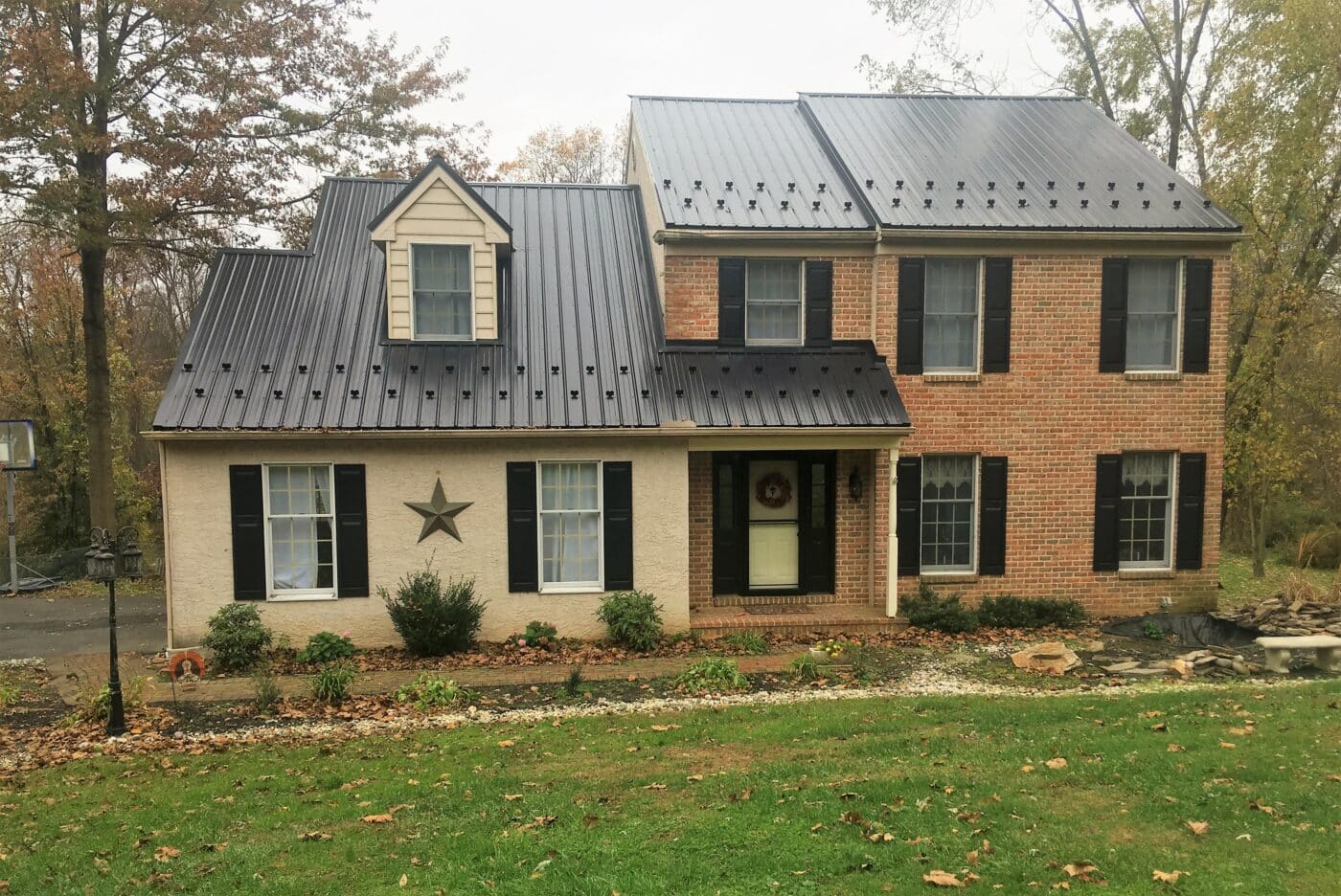 House with black Wagler Panel metal roof and snow guards