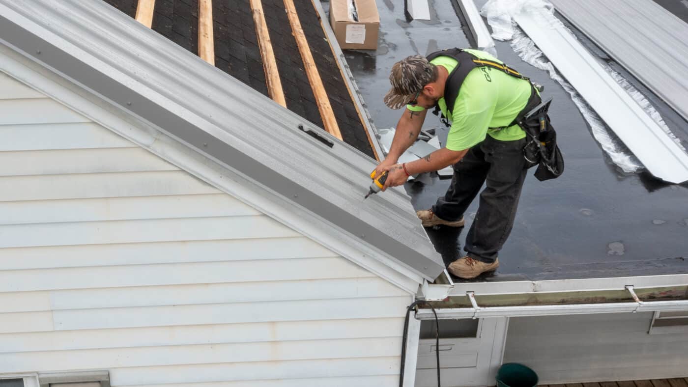 Metal panel being secured to a roof with fasteners