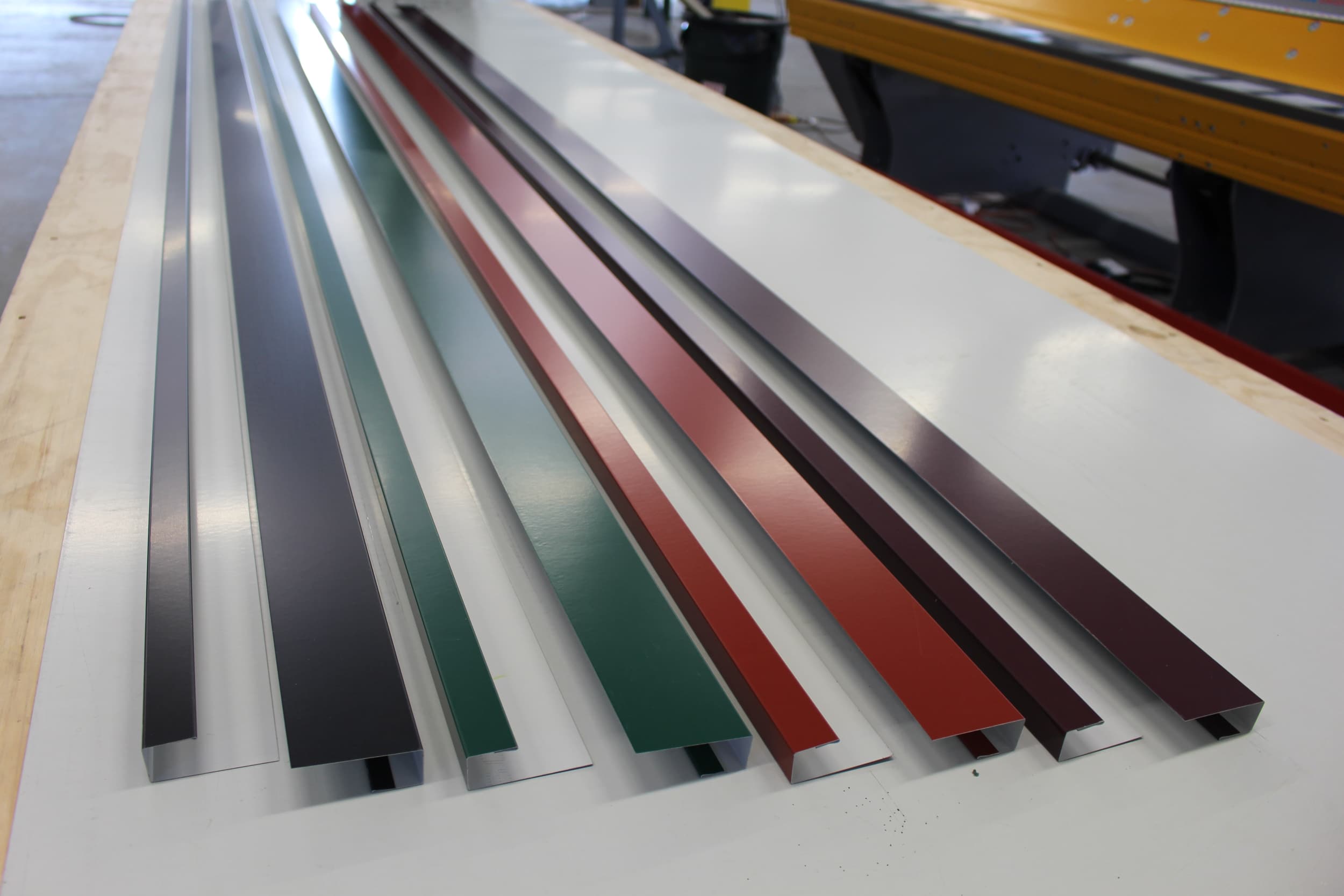 Metal trim in several different colors on a table