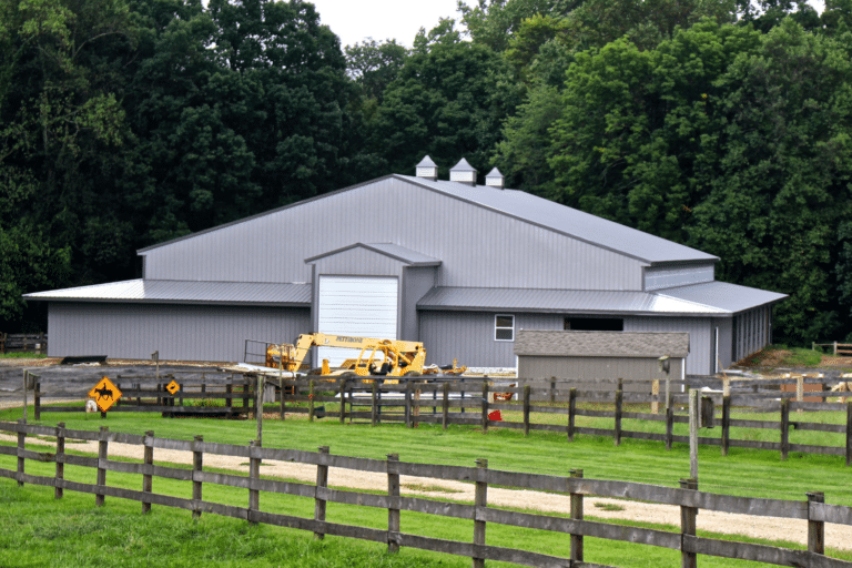 pewter gray wagler panel siding and roofing horse barn with charcoal trim in churchville md