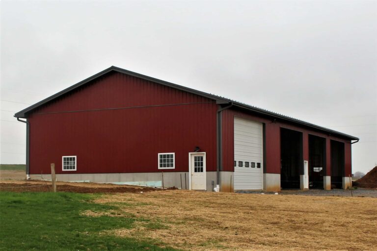 rural red metal sided garage with burnished slate metal roof and trim