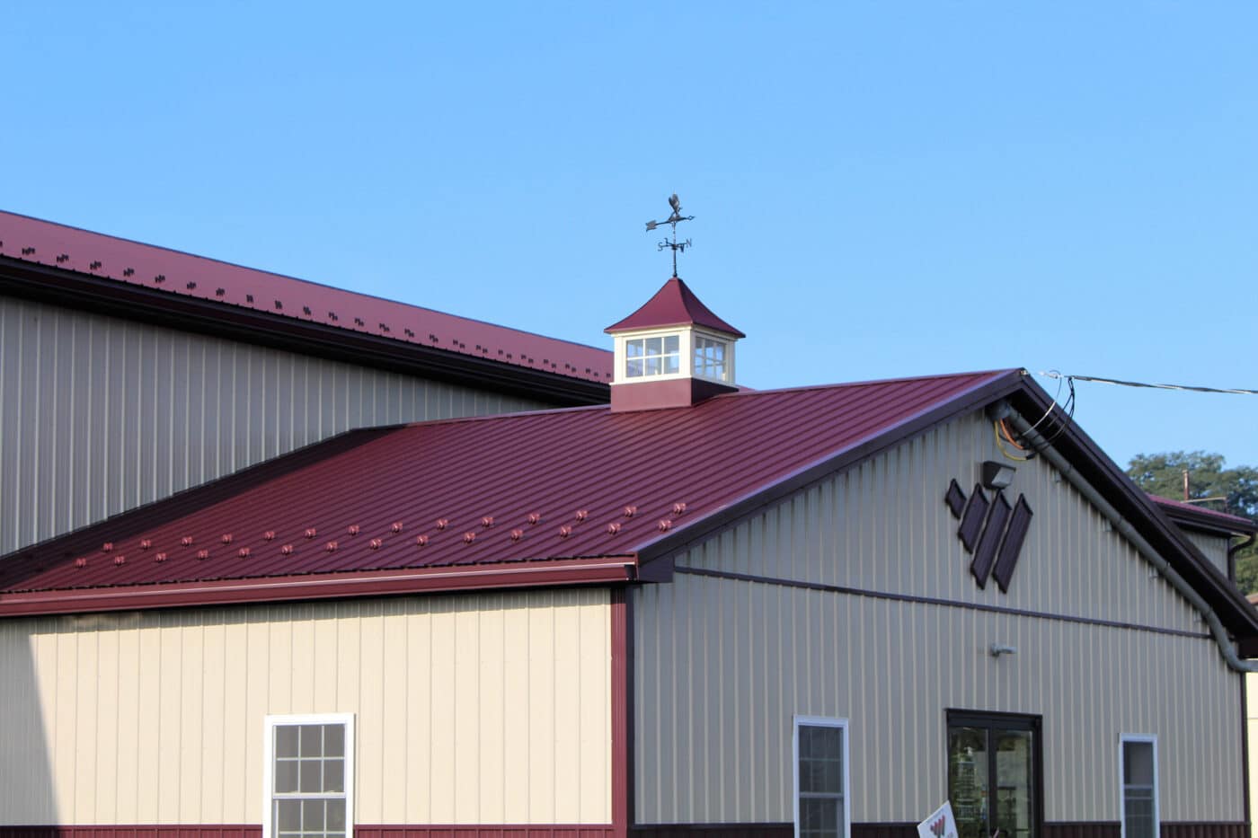 The red metal roof of a white metal building in mt holly nj